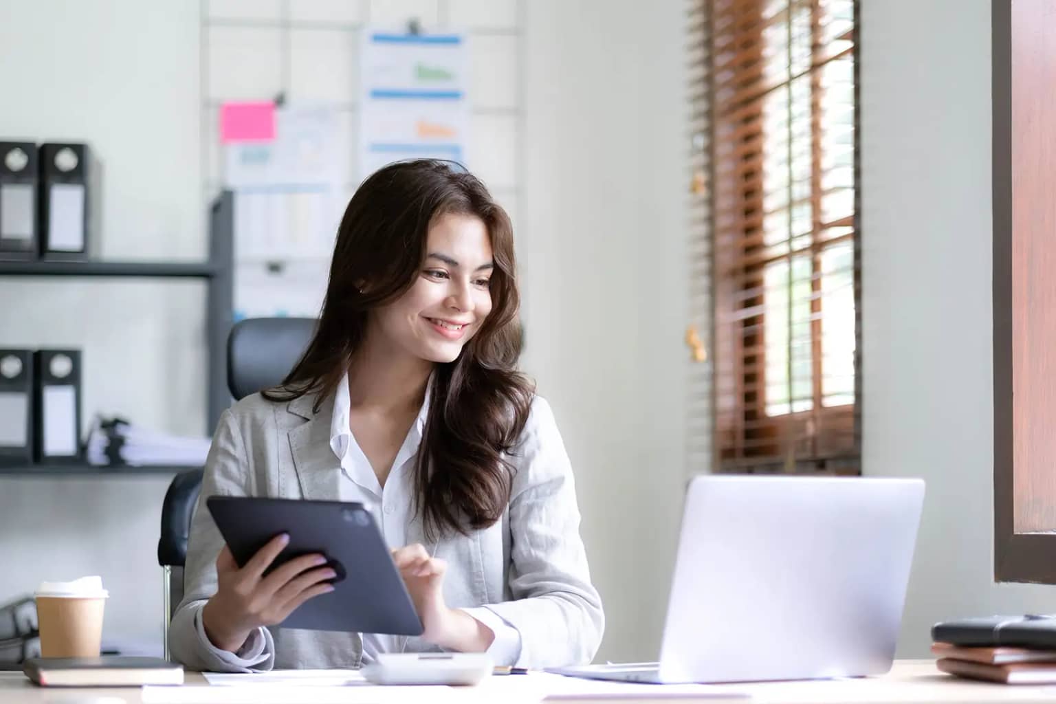 Business woman satisfied that all tax liability has been handled effectively via Reach's Merchant of Record model